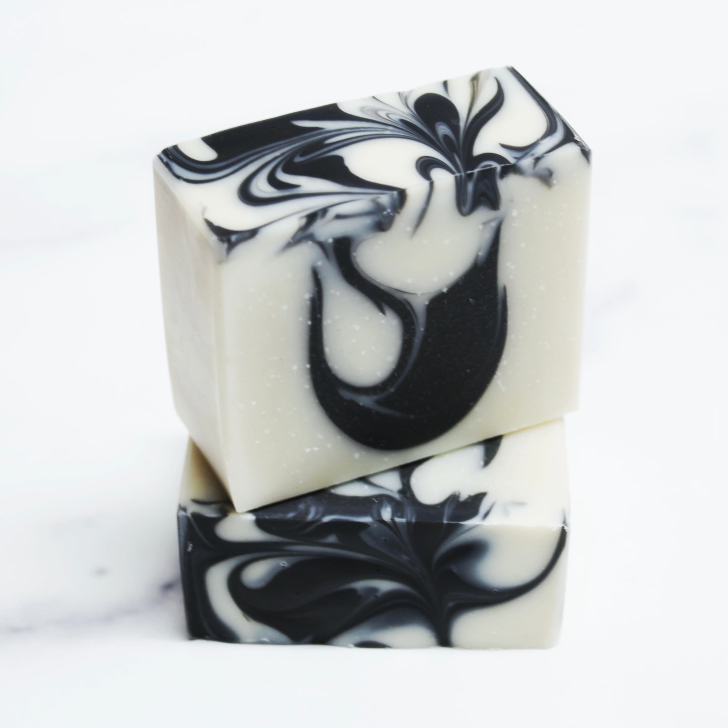 Two Black and white colored soap bars